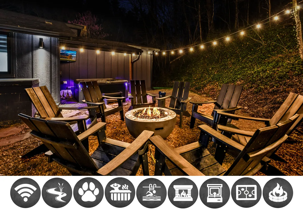 The image showcases the cabin's inviting outdoor fire pit area, surrounded by comfortable chairs and glowing string lights, all nestled amid lush greenery. The scene exudes relaxation and togetherness, with hints of activities like making s'mores, storytelling, and stargazing, set against the tranquil backdrop of the Tennessee woods.